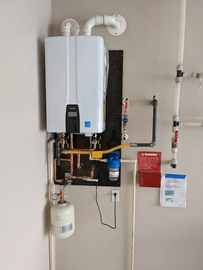 Professional plumber installing copper piping in a Rio Vista home